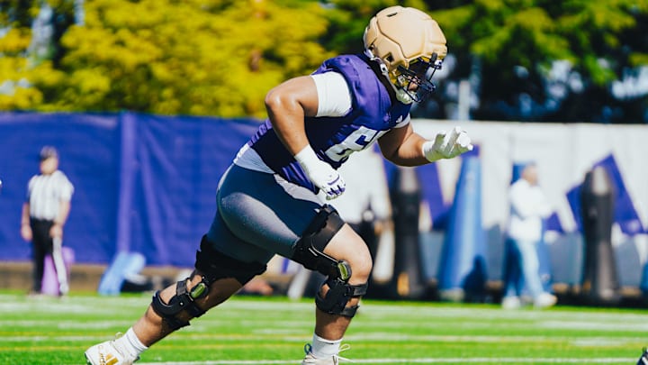 Soane Faasolo heads upfield during UW spring ball. Soane Faasolo heads upfield during UW spring ball.