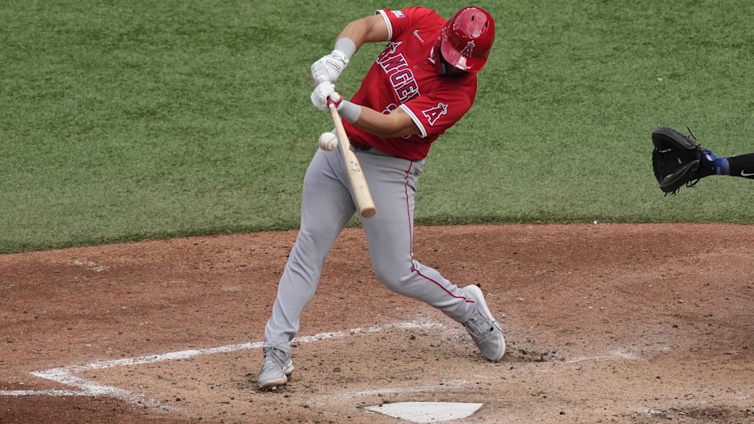 Aug 24, 2024; Toronto, Ontario, CAN; Los Angeles Angels first baseman Niko Kavadas (28) makes contact with a ball during the eighth inning at Rogers Centre. Mandatory Credit: John E. Sokolowski-Imagn Images