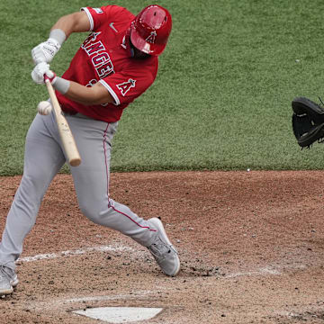 Aug 24, 2024; Toronto, Ontario, CAN; Los Angeles Angels first baseman Niko Kavadas (28) makes contact with a ball during the eighth inning at Rogers Centre. Mandatory Credit: John E. Sokolowski-Imagn Images