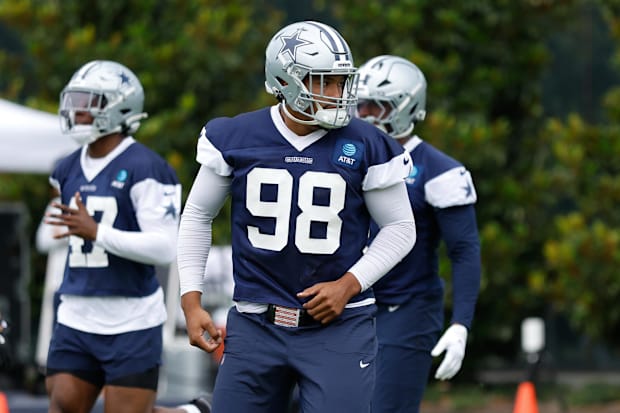 Dallas Cowboys EDGE Payton Turner goes through a drill during practice at the Ford Center at the Star Training Facility.