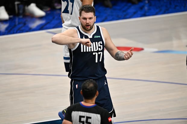 Dallas Mavericks guard Luka Doncic talks to an NBA official during a playoff game versus the Minnesota Timberwolves.