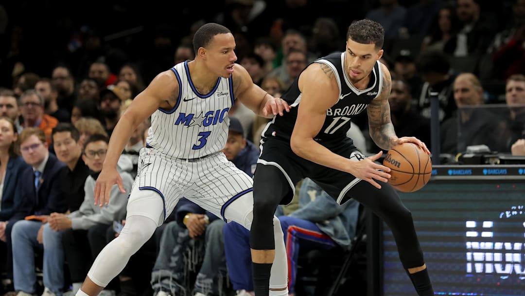 Jan 7, 2026; Brooklyn, New York, USA; Brooklyn Nets forward Michael Porter Jr. (17) controls the ball against Orlando Magic guard Desmond Bane (3) during the first quarter at Barclays Center. Mandatory Credit: Brad Penner-Imagn Images