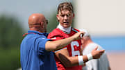 Jul 23, 2025; East Rutherford, NJ, USA; New York Giants quarterback Jaxson Dart (6) talks with head coach Brian Daboll during training camp at Quest Diagnostics Training Center. Mandatory Credit: Vincent Carchietta-Imagn Images