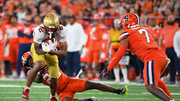 Nov 3, 2023; Syracuse, New York, USA; Boston College Eagles wide receiver Joseph Griffin Jr. (2) runs after a catch as Syracuse Orange defensive back Quan Peterson (22) and linebacker Stefon Thompson (7) defend during the first half at the JMA Wireless Dome. Mandatory Credit: Rich Barnes-Imagn Images