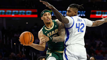 Mar 16, 2025; Fort Worth, TX, USA;  UAB Blazers forward Yaxel Lendeborg (3) looks to pass as Memphis Tigers forward Dain Dainja (42) defends during the first half at Dickies Arena. Mandatory Credit: Chris Jones-Imagn Images
