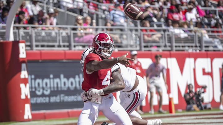 Oct 12, 2024; Tuscaloosa, Alabama, USA; South Carolina Gamecocks edge Kyle Kennard (5) brings down Alabama Crimson Tide quarterback Jalen Milroe (4) in the end zone as he attempts to throw a pass during the second quarter at Bryant-Denny Stadium. Mandatory Credit: Will McLelland-Imagn Images