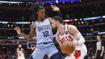 Apr 2, 2023; Chicago, Illinois, USA; Memphis Grizzlies guard Ja Morant (12) defends against Chicago Bulls guard Zach LaVine (8) during the second half at United Center. Mandatory Credit: Kamil Krzaczynski-Imagn Images