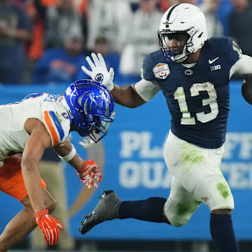 Penn State Nittany Lions running back Kaytron Allen tries to break past Boise State Broncos safety Ty Benefield.