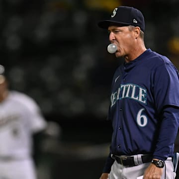 Seattle Mariners manager Dan Wilson walks onto the field for a pitching change during a game against the Oakland Athletics on Sept. 4 at Oakland Coliseum.