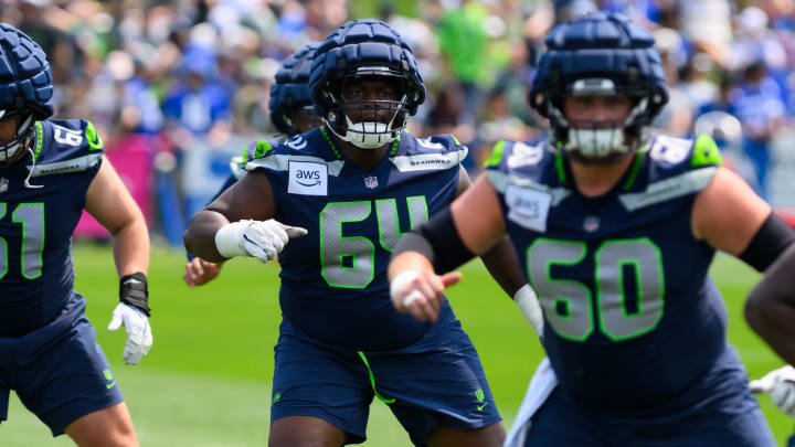 Jul 27, 2024; Renton, WA, USA; Seattle Seahawks guard Christian Haynes (64) during training camp at Virginia Mason Athletic Center. Mandatory Credit: Steven Bisig-USA TODAY Sports