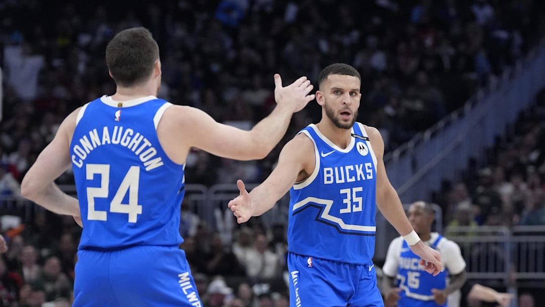 Milwaukee Bucks forward Pete Nance celebrates with Milwaukee Bucks guard Pat Connaughton after making a 3-point shot against the Detroit Pistons at Fiserv Forum on April 13.