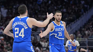 Milwaukee Bucks forward Pete Nance celebrates with Milwaukee Bucks guard Pat Connaughton after making a 3-point shot against the Detroit Pistons at Fiserv Forum on April 13.