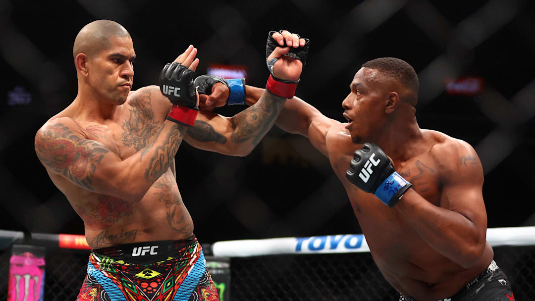 Apr 13, 2024; Las Vegas, Nevada, USA; Alex Pereira (red gloves) fights Jamahal Hill (blue gloves) during UFC 300 at T-Mobile Arena. Mandatory Credit: Mark J. Rebilas-USA TODAY Sports