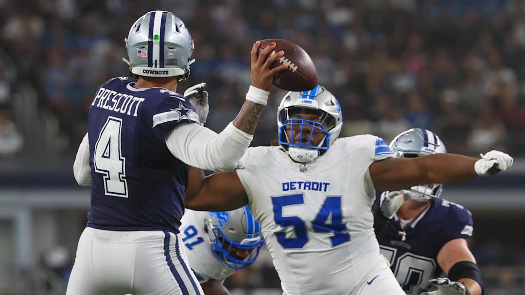 Oct 13, 2024; Arlington, Texas, USA;  Detroit Lions defensive tackle Alim McNeill (54) rushes Dallas Cowboys quarterback Dak Prescott (4) during the second half at AT&T Stadium. Mandatory Credit: Kevin Jairaj-Imagn Images