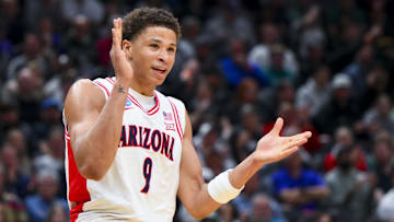 Mar 23, 2025; Seattle, WA, USA;  Arizona Wildcats forward Carter Bryant (9) reacts against the Oregon Ducks in the first half at Climate Pledge Arena. Mandatory Credit: Steven Bisig-Imagn Images