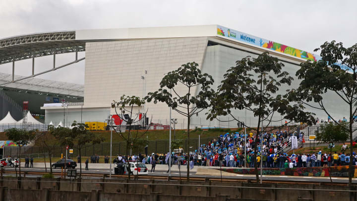 Fans wait outside the entrance to the Arena Corinthians prior to a 2014 World Cup soccer match.