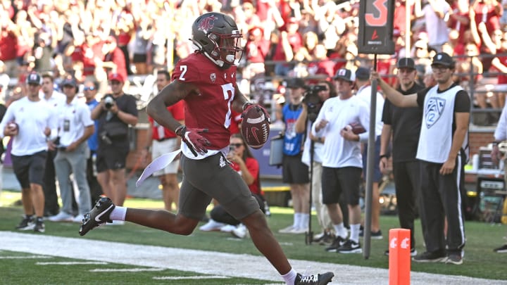 Sep 9, 2023; Pullman, Washington, USA; Washington State Cougars wide receiver Kyle Williams (2) carries the ball in for a score against the Wisconsin Badgers in the first half at Gesa Field at Martin Stadium. Mandatory Credit: James Snook-USA TODAY Sports