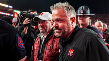 Nov 23, 2024; Lincoln, Nebraska, USA; Nebraska Cornhuskers head coach Matt Rhule and athletic director Troy Dannen walk off the field after defeating the Wisconsin Badgers at Memorial Stadium. Mandatory Credit: Dylan Widger-Imagn Images