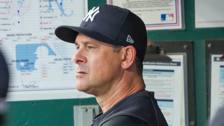 Jun 12, 2024; Kansas City, Missouri, USA; New York Yankees manager Aaron Boone (17) watches play from the dugout against the Kansas City Royals in the sixth inning at Kauffman Stadium. Mandatory Credit: Denny Medley-USA TODAY Sports