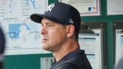 Jun 12, 2024; Kansas City, Missouri, USA; New York Yankees manager Aaron Boone watches from the dugout.