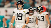 Aug 23, 2025; Miami Gardens, Florida, USA; Jacksonville Jaguars quarterback Seth Henigan (19) walks toward the sideline against the Miami Dolphins during the fourth quarter at Hard Rock Stadium. Mandatory Credit: Sam Navarro-Imagn Images
