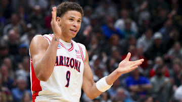 Mar 23, 2025; Seattle, WA, USA;  Arizona Wildcats forward Carter Bryant (9) reacts against the Oregon Ducks in the first half at Climate Pledge Arena. Mandatory Credit: Steven Bisig-Imagn Images