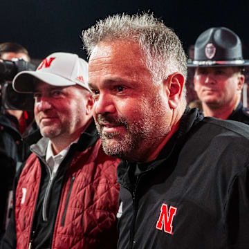 Nov 23, 2024; Lincoln, Nebraska, USA; Nebraska Cornhuskers head coach Matt Rhule and athletic director Troy Dannen walk off the field after defeating the Wisconsin Badgers at Memorial Stadium.