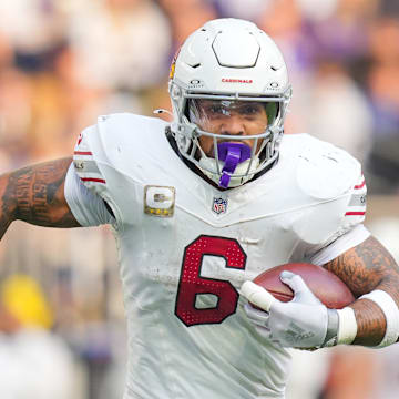 Dec 1, 2024; Minneapolis, Minnesota, USA; Arizona Cardinals running back James Conner (6) runs with the ball against the Minnesota Vikings in the second quarter at U.S. Bank Stadium. Mandatory Credit: Brad Rempel-Imagn Images