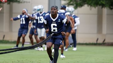 Jun 10, 2025; Arlington, TX, USA;  Dallas Cowboys safety Donovan Wilson (6) goes through a drill during practice at the Ford Center at the Star Training Facility in Frisco, Texas. Mandatory Credit: Chris Jones-Imagn Images