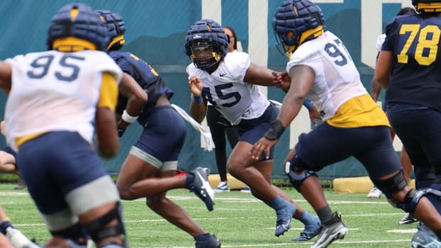 West Virginia University defensive lineman Taurus Simmons (45).