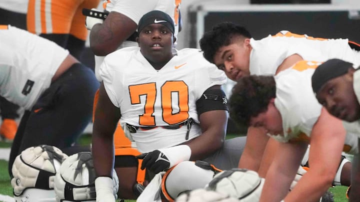 Tennessee offensive lineman David Sanders Jr. (70) stretches during Tennessee football practice, at University of Tennessee, Tuesday, March 25, 2025.