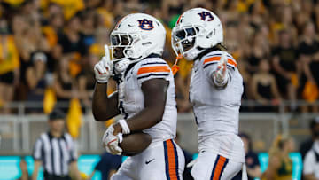 Aug 29, 2025; Waco, Texas, USA;  Auburn Tigers running back Damari Alston (0) celebrates after scoring a touchdown against the Baylor Bears during the first half at McLane Stadium. Mandatory Credit: Chris Jones-Imagn Images