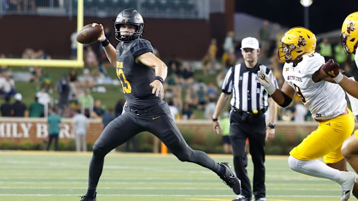 Sep 20, 2025; Waco, Texas, USA; Baylor Bears quarterback Sawyer Robertson (13) looks to pass as Arizona State Sun Devils defensive lineman Elijah O'Neal (9) defends during the first half at McLane Stadium. Mandatory Credit: Chris Jones-Imagn Images