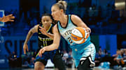 May 31, 2025; Arlington, Texas, USA;  Chicago Sky guard Courtney Vandersloot (22) drives to the basket ahead of Dallas Wings guard JJ Quinerly (11) during the first half at College Park Center. Mandatory Credit: Chris Jones-Imagn Images