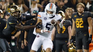 Aug 29, 2025; Waco, Texas, USA;  Auburn Tigers wide receiver Horatio Fields (5) catchesa pass against Baylor Bears safety Cameren Jenkins (23) during the second half at McLane Stadium. Mandatory Credit: Chris Jones-Imagn Images