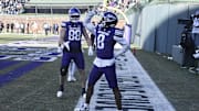 Nov 30, 2024; Chicago, Illinois, USA;  Northwestern Wildcats wide receiver A.J. Henning (8) celebrates after scoring a touchdown against the Illinois Fighting Illini during the second half at Wrigley Field. Mandatory Credit: Matt Marton-Imagn Images