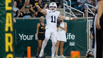 Aug 29, 2025; Waco, Texas, USA;  Auburn Tigers quarterback Jackson Arnold (11) celebrates after scoring a touchdown against the Baylor Bears during the first half at McLane Stadium. Mandatory Credit: Chris Jones-Imagn Images