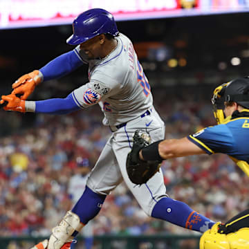 Sep 13, 2024; Philadelphia, Pennsylvania, USA; New York Mets shortstop Francisco Lindor (12) hits a single during the fifth inning against the Philadelphia Phillies at Citizens Bank Park. Mandatory Credit: Bill Streicher-Imagn Images