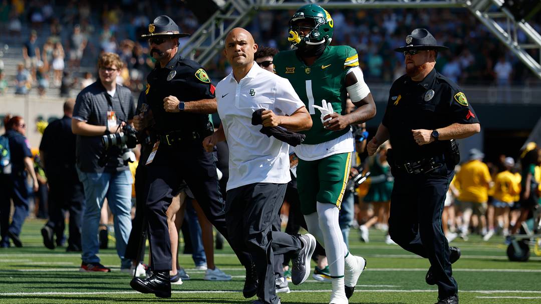 Sep 13, 2025; Waco, Texas, USA; Baylor Bears head coach Dave Aranda takes the field before opening kick against the Samford Bulldogs at McLane Stadium. Mandatory Credit: Chris Jones Sep 13, 2025; Waco, Texas, USA; Baylor Bears head coach Dave Aranda takes the field before opening kick against the Samford Bulldogs at McLane Stadium. Mandatory Credit: Chris Jones