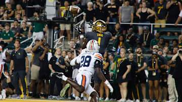 Aug 29, 2025; Waco, Texas, USA;  Baylor Bears tight end Michael Trigg (1) catches a touchdown pass against Auburn Tigers safety Kensley Louidor-Faustin (28) during the second half at McLane Stadium. Mandatory Credit: Chris Jones-Imagn Images