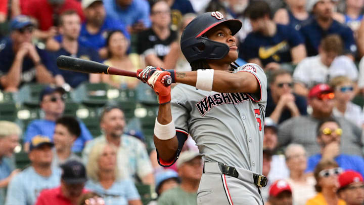 Jul 13, 2024; Milwaukee, Wisconsin, USA; Washington Nationals shortstop C.J. Abrams (5) hits a 2-run home run against the Milwaukee Brewers in the ninth inning at American Family Field. 