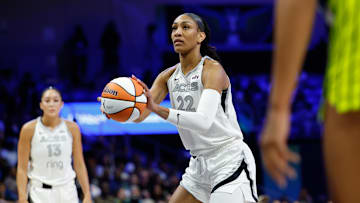 Jul 16, 2025; Arlington, Texas, USA;  Las Vegas Aces center A'ja Wilson (22) shoots a free throw against the Dallas Wings during the first half at College Park Center. 