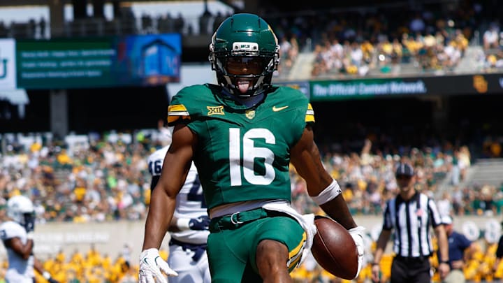 Sep 13, 2025; Waco, Texas, USA; Baylor Bears wide receiver Kobe Prentice (16) reacts after scoring a touchdown against the Samford Bulldogs during the first half at McLane Stadium. Mandatory Credit: Chris Jones-Imagn Images
