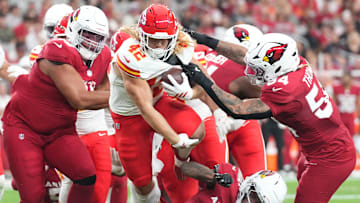  Kansas City Chiefs running back Carson Steele (42) runs against the Arizona Cardinals during the first half at State Farm Stadium.