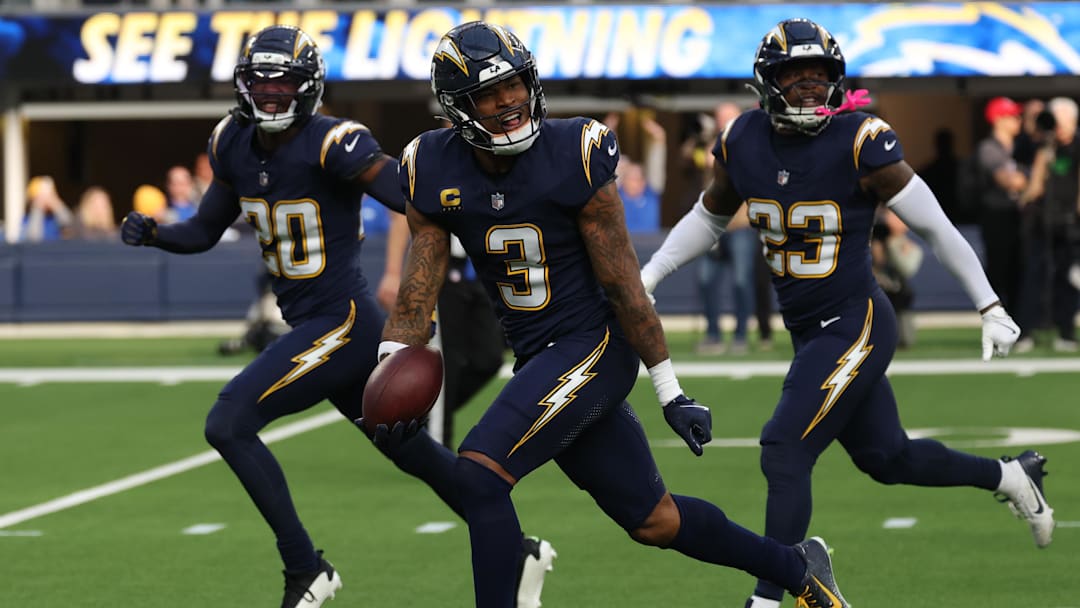 Derwin James celebrates with teammates after an interception. Derwin James celebrates with teammates after an interception.