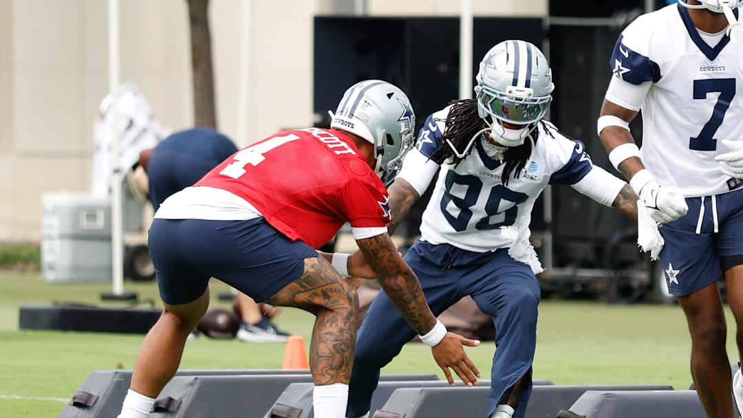 Jun 10, 2025; Arlington, TX, USA;  Dallas Cowboys quarterback Dak Prescott (4) celebrates with Dallas Cowboys wide receiver CeeDee Lamb (88) during a drill at the Ford Center at the Star Training Facility in Frisco, Texas. Mandatory Credit: Chris Jones-Imagn Images