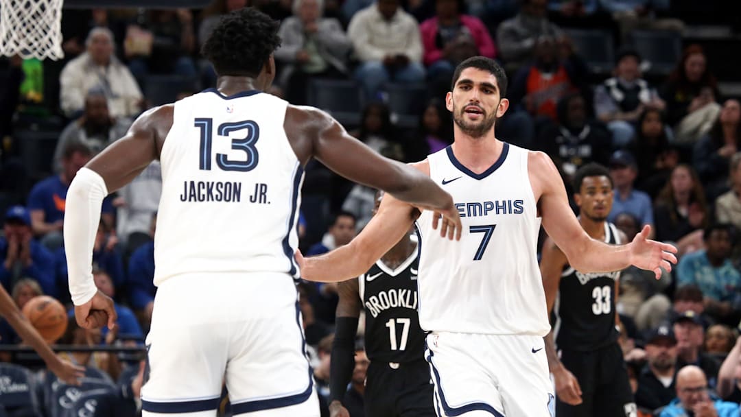 Feb 26, 2024; Memphis, Tennessee, USA; Memphis Grizzlies forward-center Santi Aldama (7) reacts with forward-center Jaren Jackson Jr. (13) during the second half against the Brooklyn Nets at FedExForum. Mandatory Credit: Petre Thomas-Imagn Images