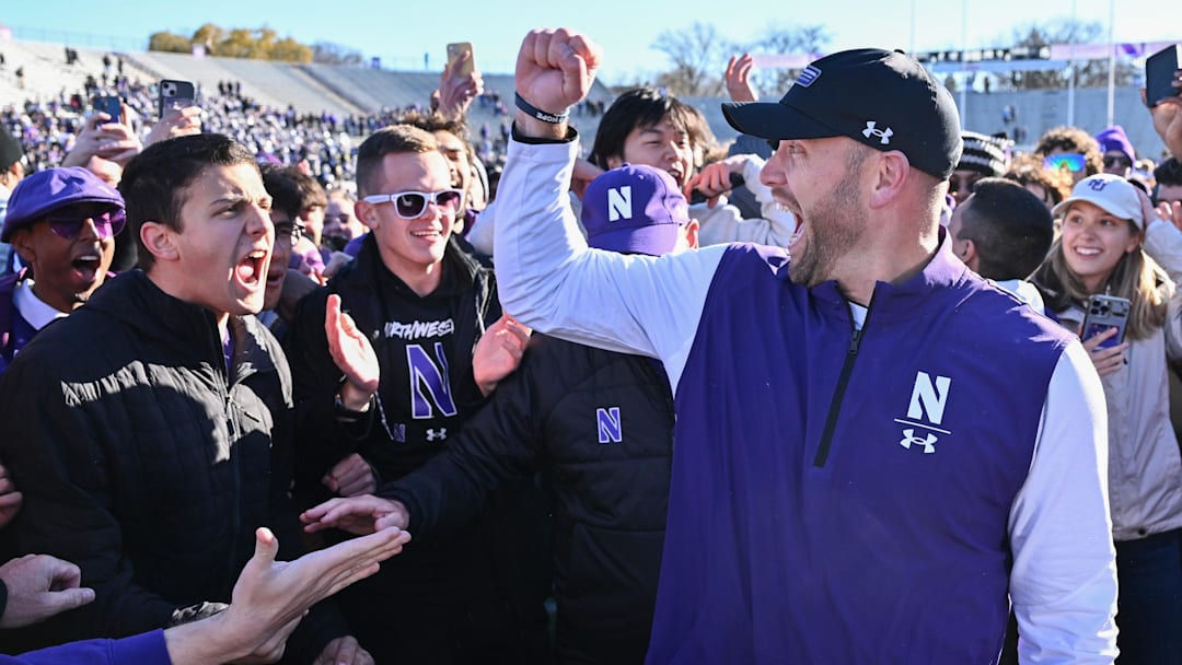 Nov 18, 2023; Evanston, Illinois, USA; Northwestern Wildcats head coach David Braun celebrates with fans after defeating the Purdue Boilermakers 23-15 at Ryan Field. Mandatory Credit: Jamie Sabau-Imagn Images Nov 18, 2023; Evanston, Illinois, USA; Northwestern Wildcats head coach David Braun celebrates with fans after defeating the Purdue Boilermakers 23-15 at Ryan Field. Mandatory Credit: Jamie Sabau-Imagn Images