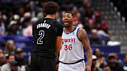 Feb 24, 2025; Washington, District of Columbia, USA; Washington Wizards guard Marcus Smart (36) exchanges words with Brooklyn Nets forward Cameron Johnson (2) in the second half at Capital One Arena. Mandatory Credit: Geoff Burke-Imagn Images