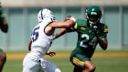 Sep 13, 2025; Waco, Texas, USA;  Samford Bulldogs quarterback Brady Stober (15) is pressured by Baylor Bears safety Micah Gifford (24) during the second half at McLane Stadium